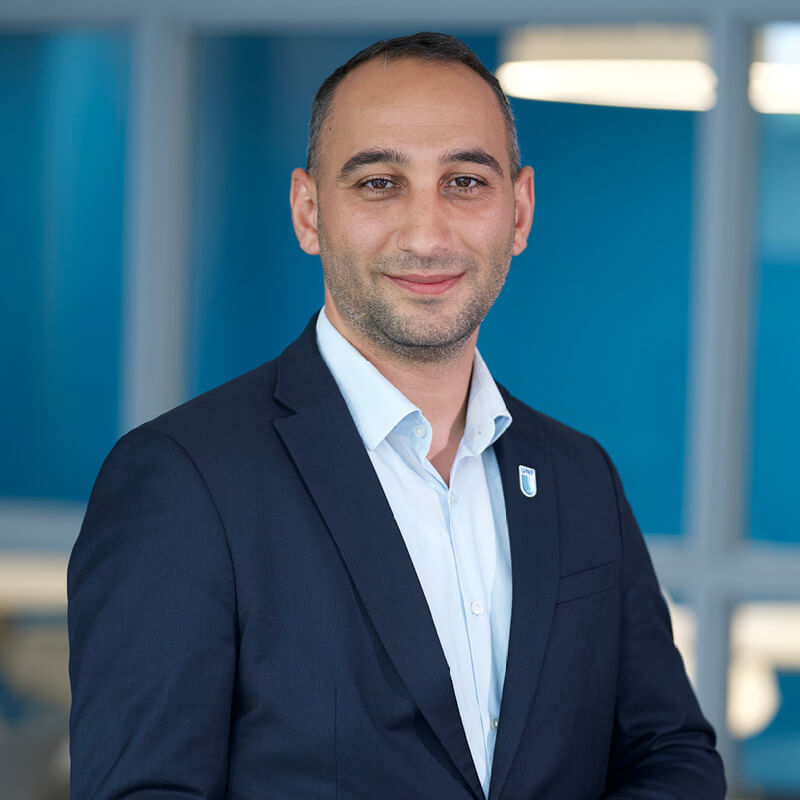 A portrait of Hassan Baz Chamas smiling