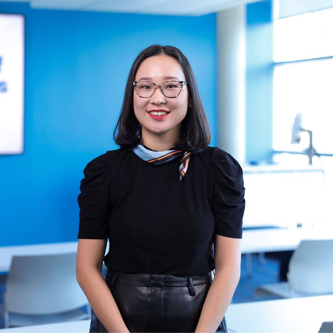 A portrait Enkhzul Khishigbayar Ibrahim smiling for the camera