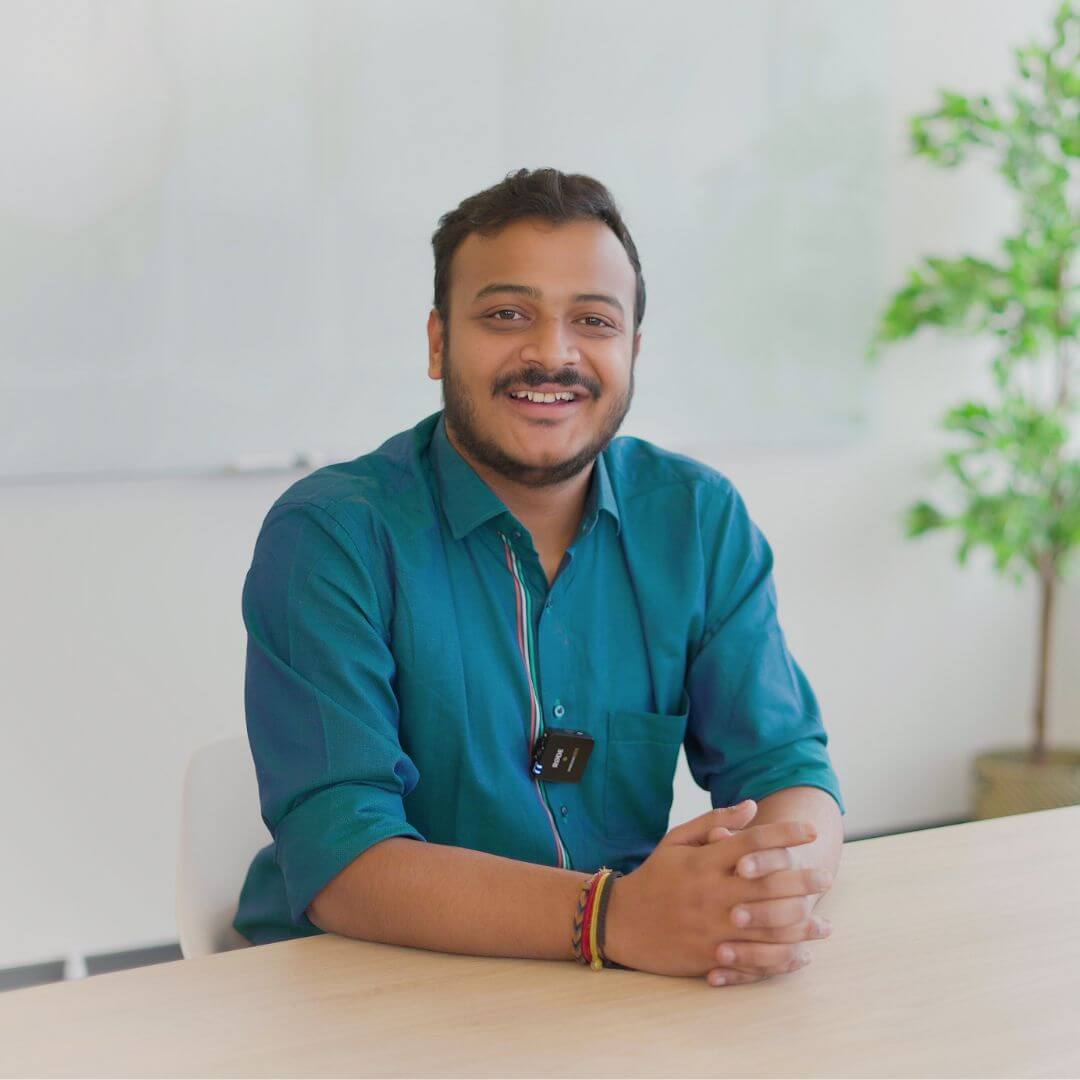A portrait Manthan Narsingh Pandey smiling for the camera
