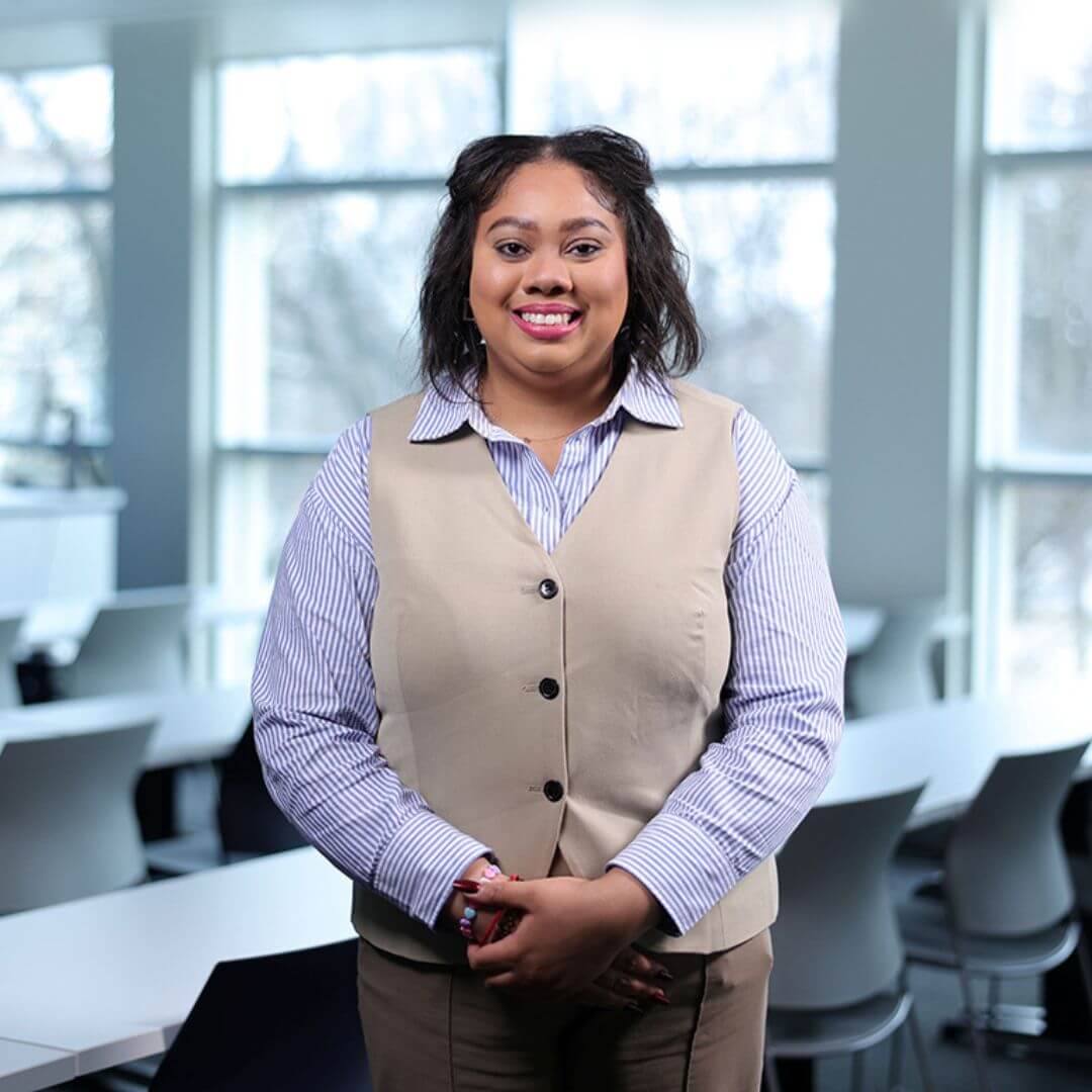 A portrait Rochelle Elizbeth Harriott smiling for the camera