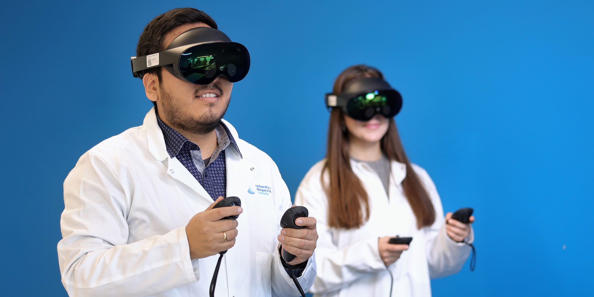 Medical students wearing VR headset and learning through using technology