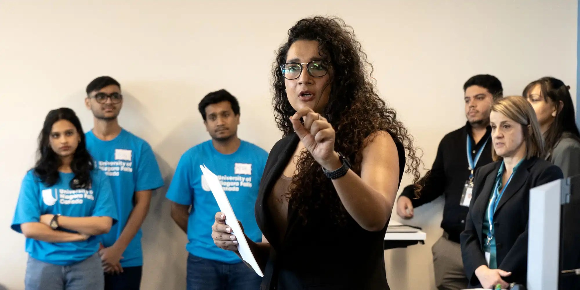 A faculty member giving instruction to UNF students