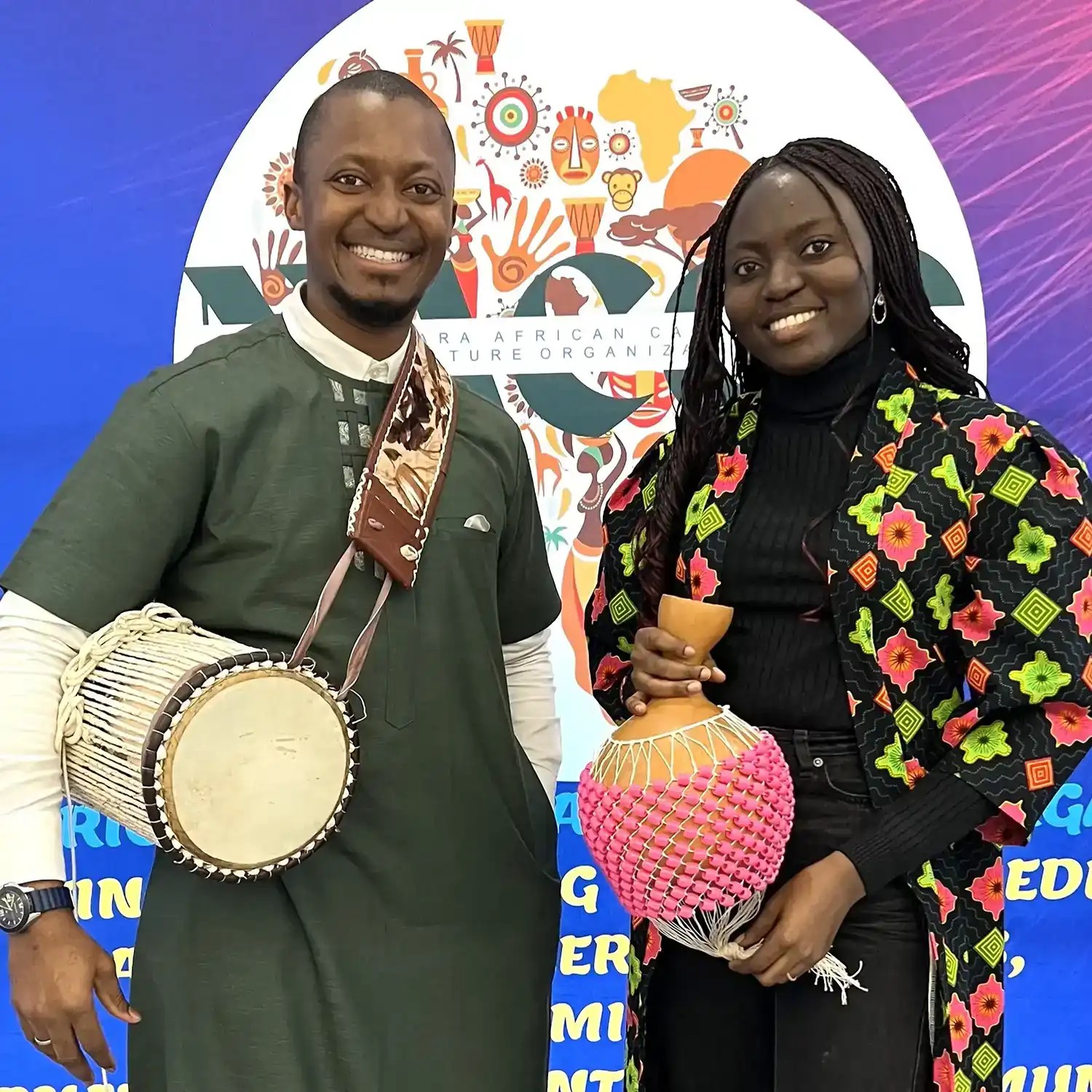 A African male and a woman posing for a picture