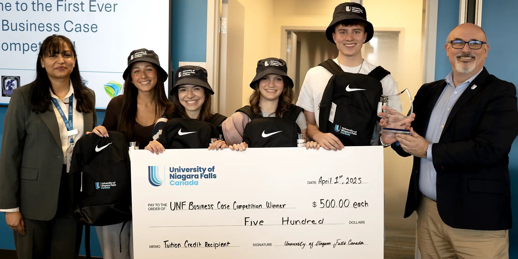 Winning UNF students holding a cheque certificate